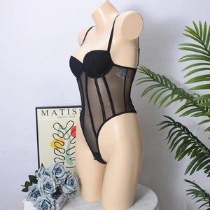 Detail view of black mesh bodysuit featuring vertical boning and underwire cups