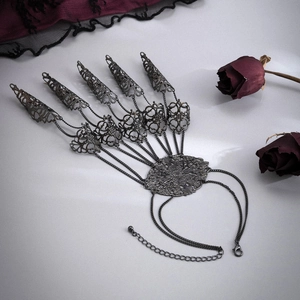 Gothic slave bracelet with five finger claw rings and cone tassel in vintage black alloy