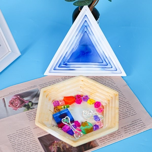 Detail of triangle silicone mold and hexagonal resin tray with colorful DIY accessories