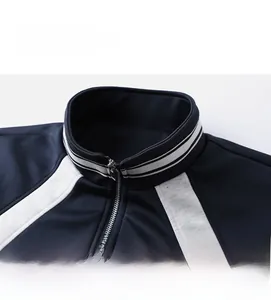 Detail of stand-up collar with striped trim and silver metal zipper on sports jacket
