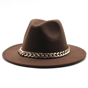 Detail of a dark brown felt jazz hat featuring a stylish gold chain trim on a white background