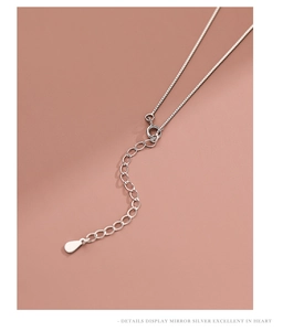 Detail shot of the S925 silver necklace lobster clasp and adjustable extension chain