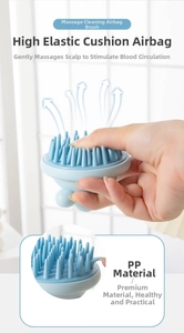 Detail of light blue silicone scalp massager brush with soft cone-shaped massage bristles