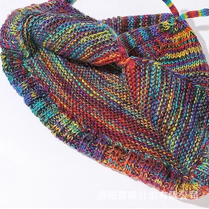 Close-up of vibrant rainbow striped knit texture and soft multi-color yarn weaving detail
