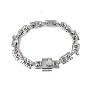 Macro shot of silver link chain bracelet with a sparkling crystal toggle closure
