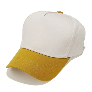 Detail of multi-stitch baseball cap brim in yellow and beige sturdy canvas fabric