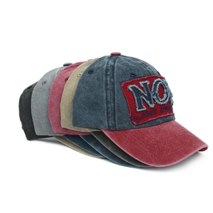 Five assorted vintage washed cotton baseball caps with distressed 'NO' letter embroidery