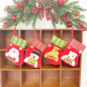 Detailed view of four felt Christmas stockings with Santa, Snowman, Reindeer, and Bear