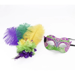 Detail of masquerade mask set with purple green and gold feathers and glitter finish