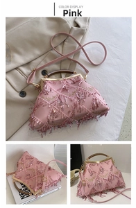 Detail of pink sequin evening bag featuring wooden handle and delicate tassel textures
