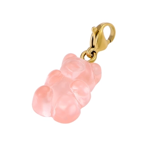 Macro view of a pink resin gummy bear pendant with a golden lobster clasp on white background