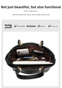 Internal view of a black pebbled leather tote bag showing spacious multi-compartment storage