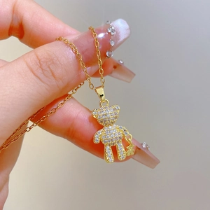 Luxurious gold bear pendant necklace with sparkling crystals and smaller bear charm