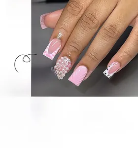Detail of pink French press-on nails with 3D ripples, pearls, and leopard print accents
