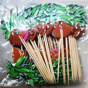 Close-up of coconut tree shaped decorative fruit picks in transparent bulk packaging