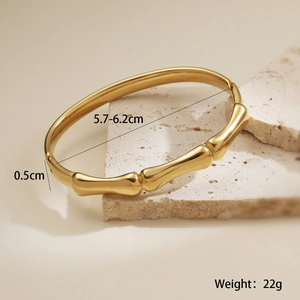 Detailed view of 18K gold plated bamboo bangle with 5.7-6.2cm diameter and weight markers