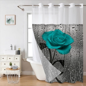Detail of waterproof shower curtain with large blue rose print and metal grommets on top
