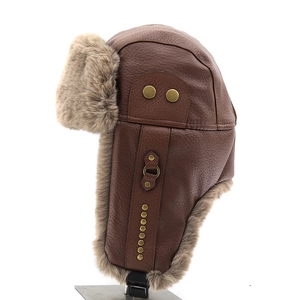 Macro view of brown faux leather aviator hat with plush fur lining and metal rivets