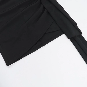 Detailed close-up of black square neck dress showing fabric texture and elegant draping