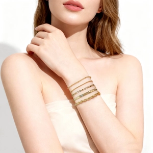 Five-piece gold-plated chain bracelet set featuring curb, snake, and twisted link designs