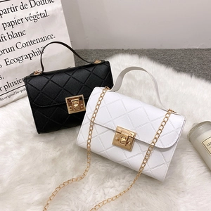 Chic quilted flap crossbody bags in black and white with gold chain straps and top handles