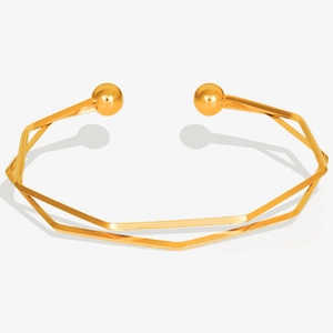Detail of 18K gold-plated stainless steel open bangle with layered geometric design