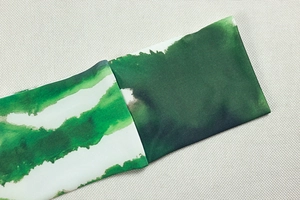 Detail view of the green ink gradient print on knitted fabric for women two-piece sets