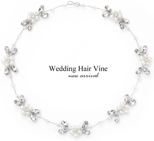 Detail of silver wedding hair vine with white pearls and sparkling leaf rhinestones