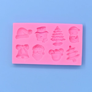 Pink silicone Christmas mold for DIY baking with snowman, tree and Santa shapes