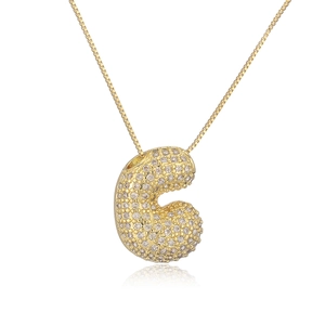 Gold plated 26 English letter C pendant necklace with sparkling cubic zirconia on white background