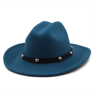 Detailed view of peacock blue felt fedora hat featuring black band with gold metal studs