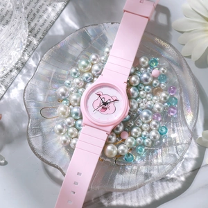 Pink kids quartz watch with cartoon pig dial on silicone strap in shell tray