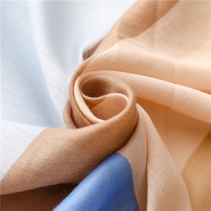 Close-up of lightweight cotton linen scarf showing fine texture and blue beige color block