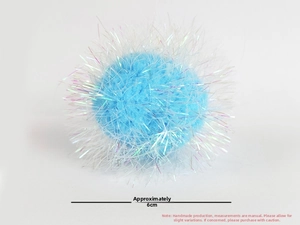 Close-up of a 6cm light blue crinkle paper ball cat toy with iridescent long fibers