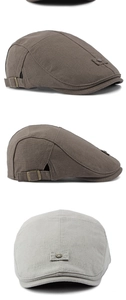 Detail view of linen blend beret with vintage metal side buckle and textured fabric