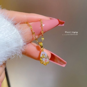 Golden teardrop phoenix necklace with clear zircon stone for an elegant luxury style