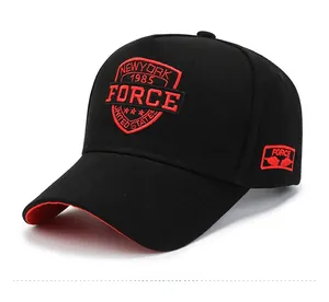 Detail of red shield embroidery with New York 1985 text on black baseball cap side