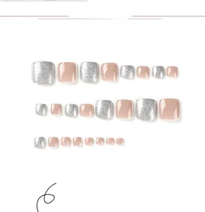 Detail view of 22-piece nude and silver glitter press-on toenails on white background