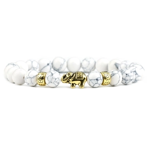 Beaded white marble agate bracelet featuring a gold elephant charm and ornate spacers