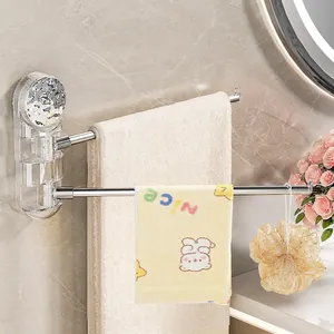 Rotating suction cup towel rack with silver rods on transparent acrylic base