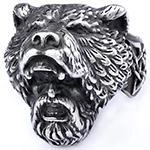 Detail of vintage oxidized silver Viking ring featuring intricate warrior and bear head carving