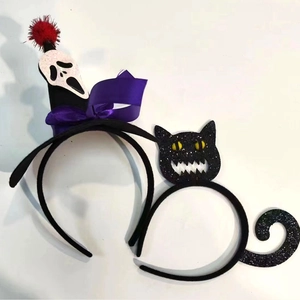 Detail of Halloween headbands with Scream mask, purple bow and black cat with glitter finish