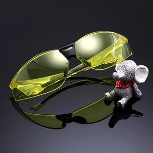 Protective outdoor sports goggles with yellow lenses and ANSI Z87.1 safety standard certification
