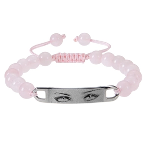 Detail of pink beaded woven bracelet with a custom eye photo on the silver metal plate