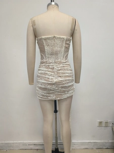 Close-up of the back hidden zipper and pleated lace texture on a white corset dress