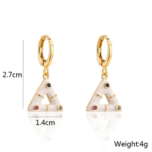 Detail shot of triangle earrings with white enamel and colorful gems including dimensions