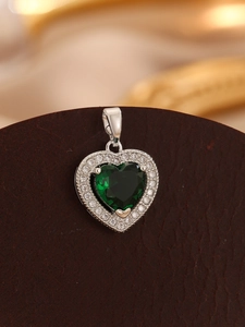 Close-up of heart pendant with green gemstone and micro-pave sparkling zircons