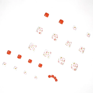 Summer peach and orange press-on toenails set with hand-painted patterns on white background