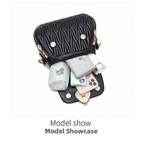 Interior view showing the large capacity of the black quilted bucket bag with daily items