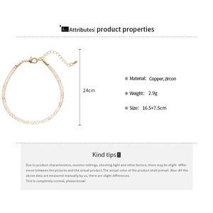 Vue détaillée du bracelet en maille dorée avec zircon et dimensions de longueur
